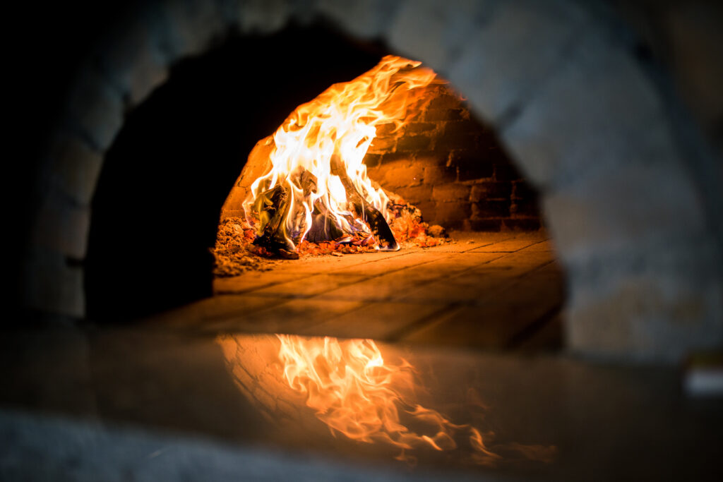 Traditional Pizza oven, burning wood and flames