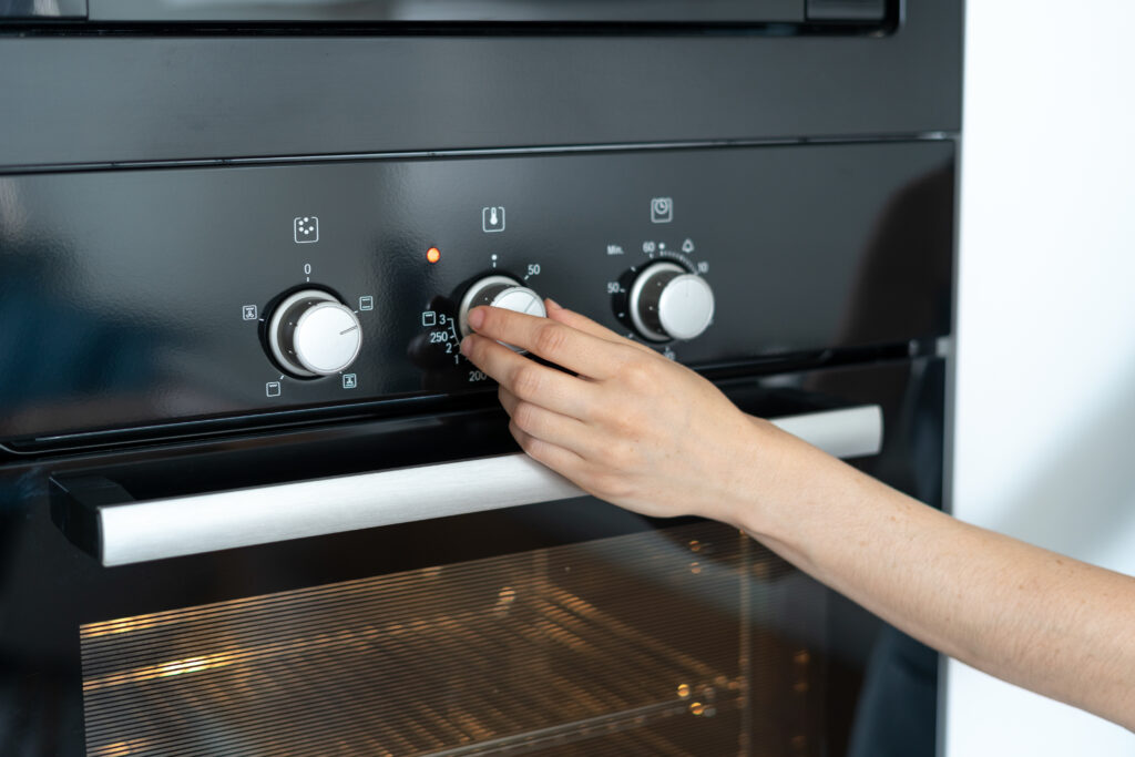 Woman Optimizing Oven Temperature