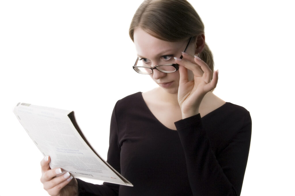 woman read a oven manual carefully