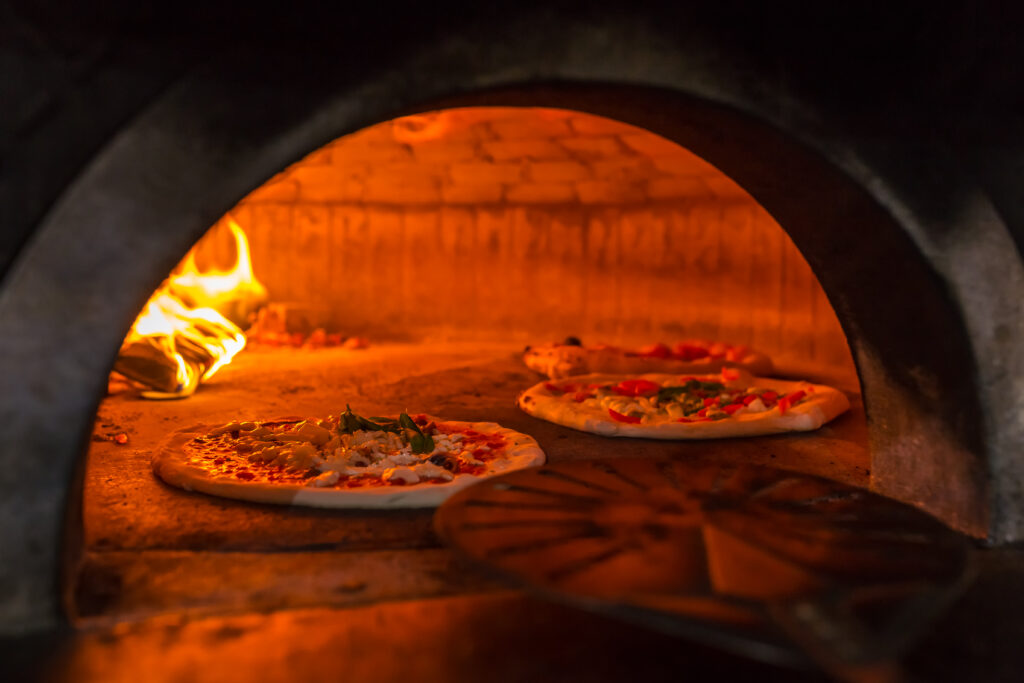 Original neapolitan pizza margherita in a traditional wood oven 